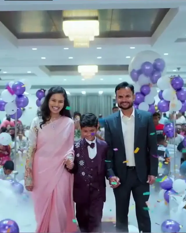 Family walking into a decorated birthday celebration